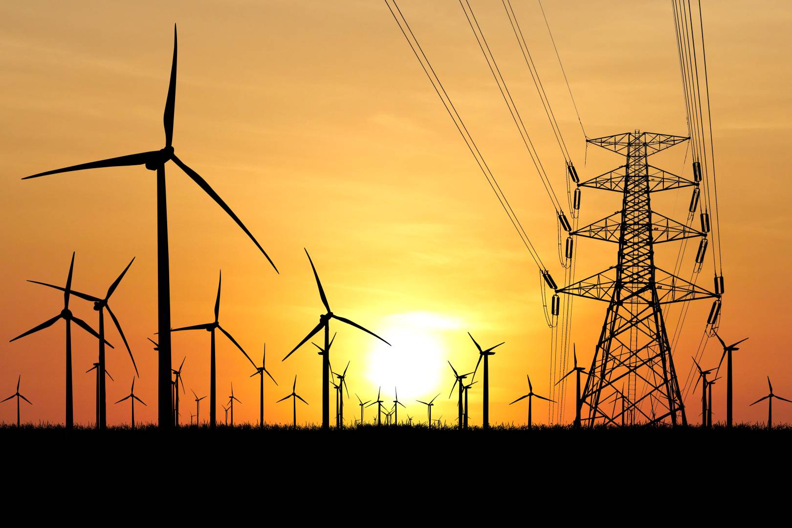 Pylônes électriques et éoliennes symbolisant la production et le transport d’énergie en France, en lien avec la CSPE 2026 et la fiscalité énergétique.