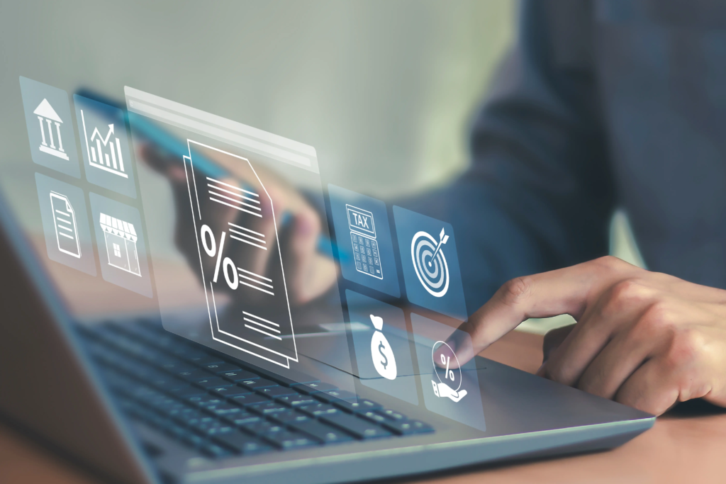 Interface numérique affichant des icônes de fiscalité, taux, documents et objectifs financiers sur un ordinateur portable, illustrant la gestion des taxes et coûts énergétiques pour les entreprises