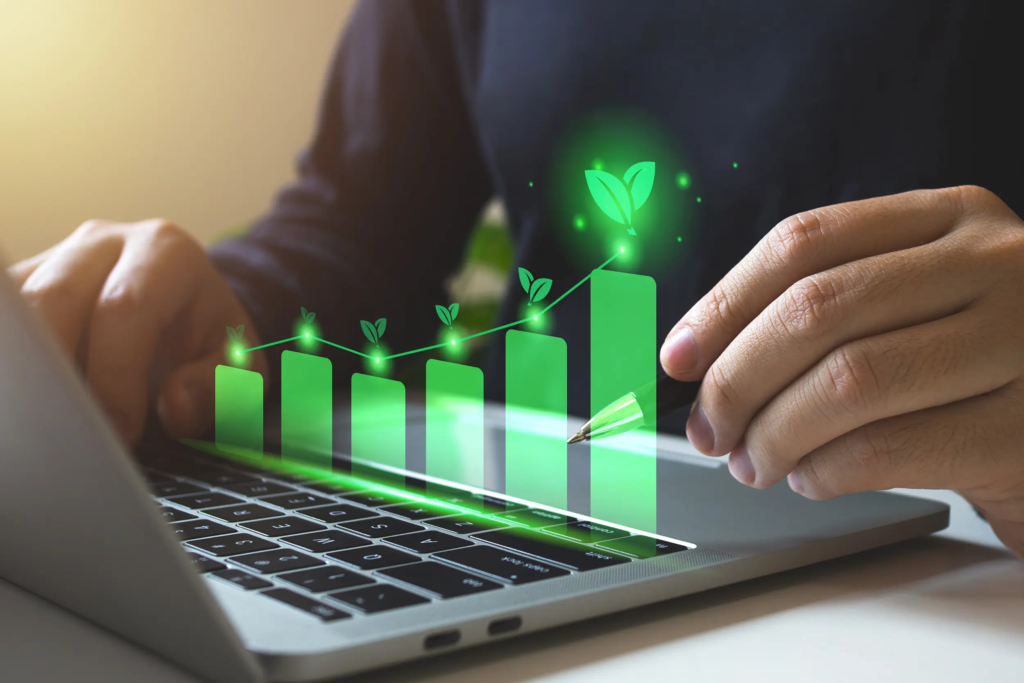 Personne consultant un ordinateur avec un histogramme de projets verts, illustrant des projets d’économies d’énergie finançables dans le cadre de la 6e période CEE.